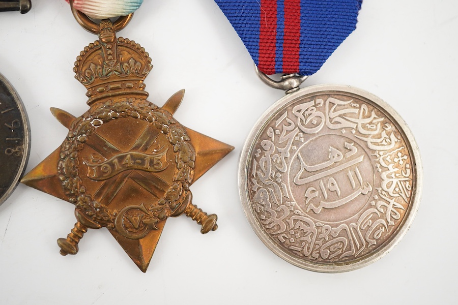 A medal group comprising of a Meritorious Service medal, a 1939 to 1945 Defence Medal, and a First World War trio awarded to 3824 SJT. F.W.G. Wakefield. R.F.A., together with a Delhi Durbar Medal 1911, crudely engraved t